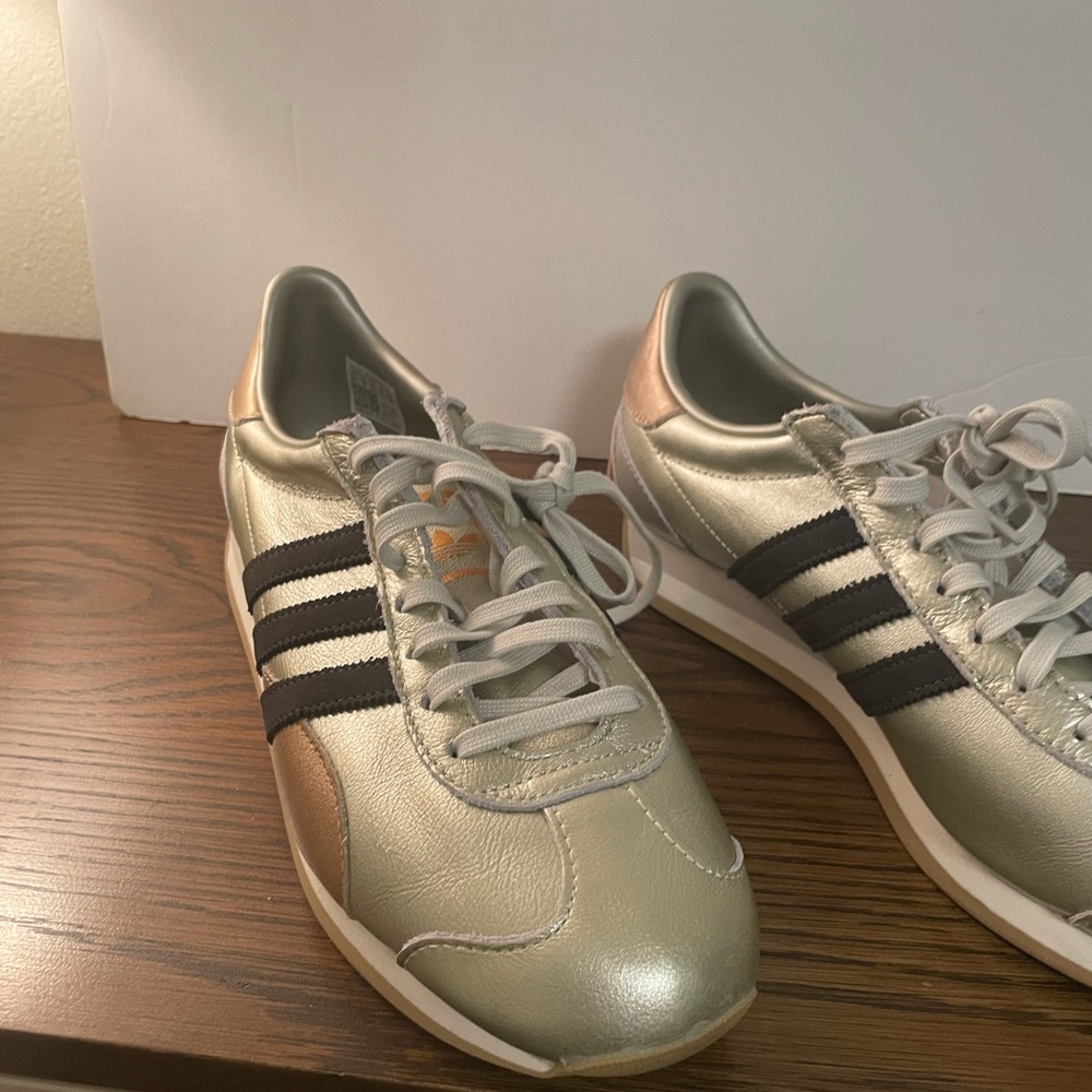 adidas Women’s Metallic Gold and Black Striped Lace-Up Sneakers